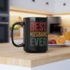 Black ceramic mug with distressed red, yellow, and green text reading 