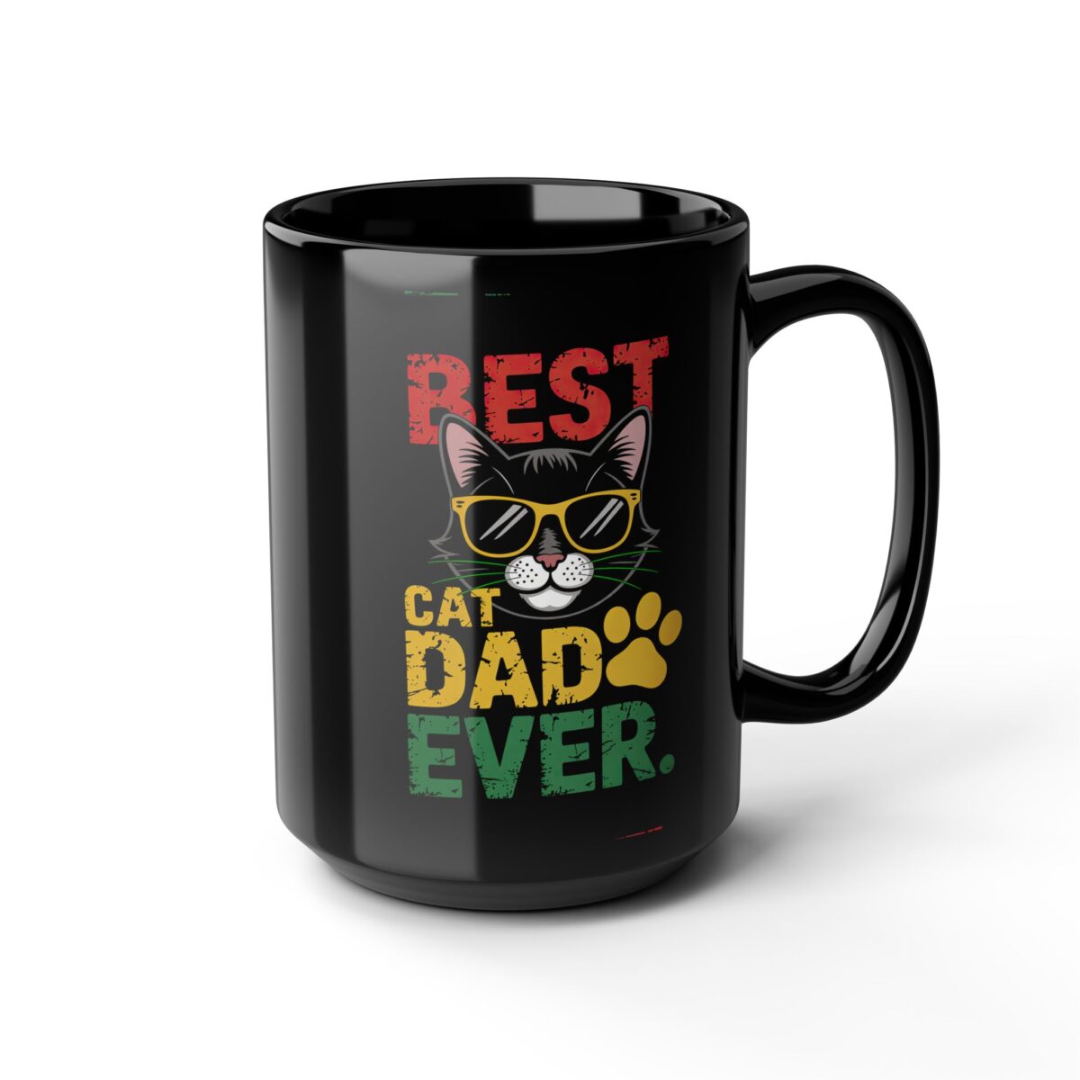 A black mug with the text "BEST CAT DAD EVER" in distressed red, yellow, and green lettering. A cartoon cat wearing sunglasses and a yellow paw print are also on the mug.
