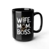 Black ceramic mug with white text that reads