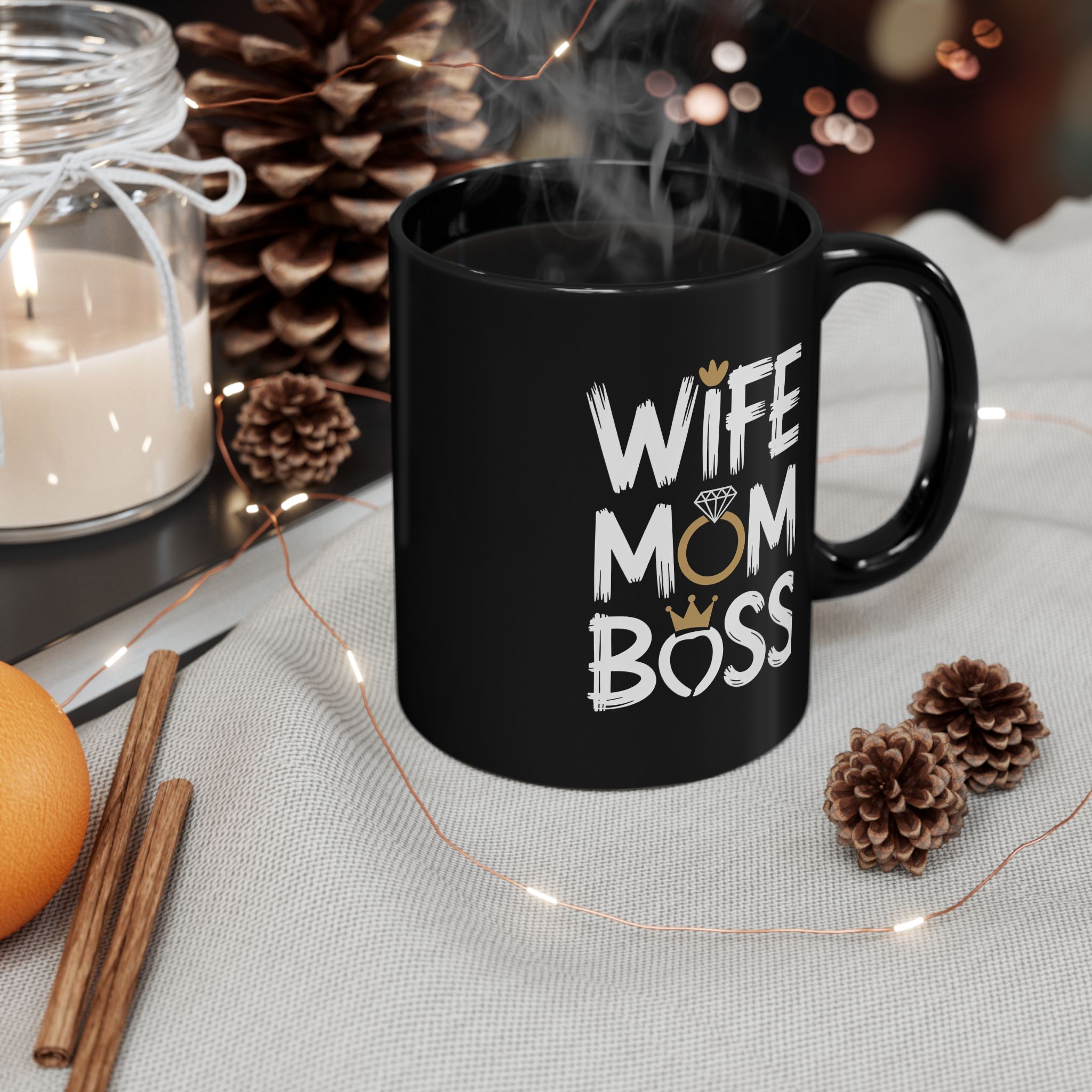 Black ceramic mug with white text that reads "WIFE MOM BOSS".