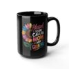 Black ceramic mug with a colorful sunflower graphic and text reading 