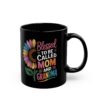 Black ceramic mug with a colorful sunflower graphic and text that reads 