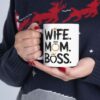 White ceramic mug with bold black text: WIFE. MOM. BOSS. accented with gold crown and diamond ring graphics.