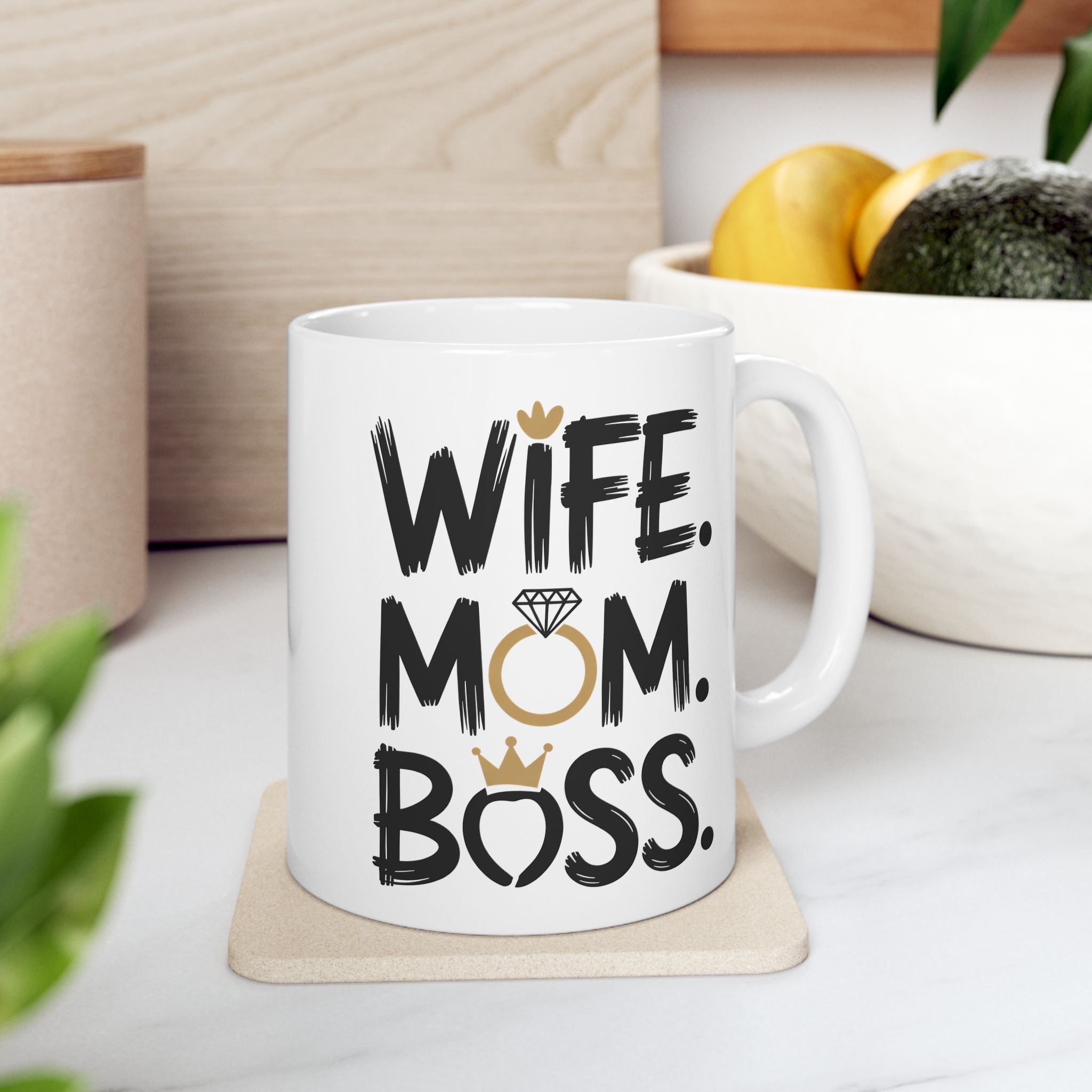 White ceramic mug with bold black text and gold accents, reading "WIFE. MOM. BOSS."