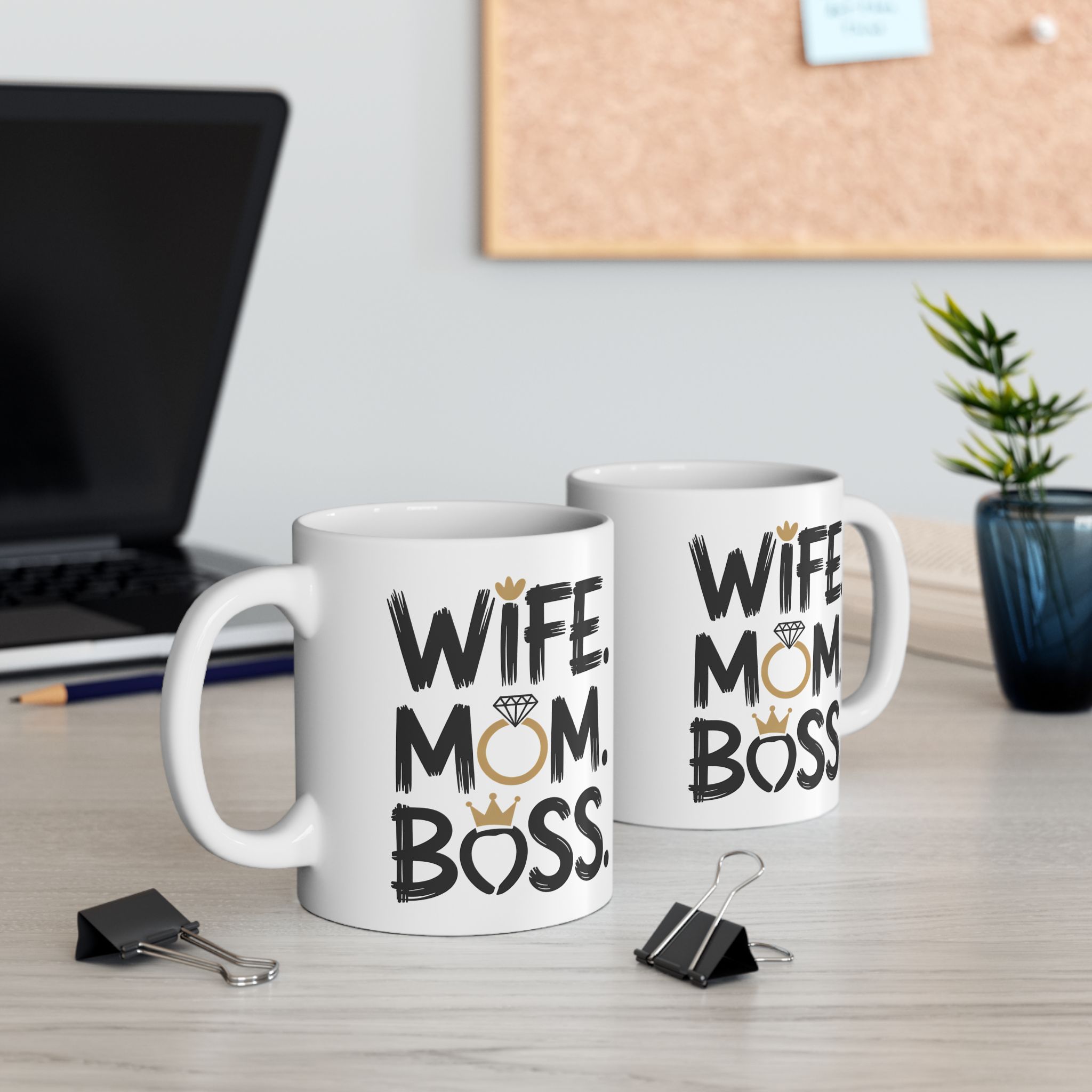 White ceramic mugs with black text reading "WIFE MOM BOSS" and gold accents.