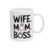 White ceramic mug with black text 