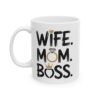 White ceramic mug with black text that reads
