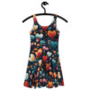 Fit and flare dress with an all over print of stylized hearts and floral elements in warm, vibrant colors on a dark navy background.