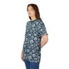 White daisies and leaves on a dark blue background cover this full print shirt, creating a botanical pattern.