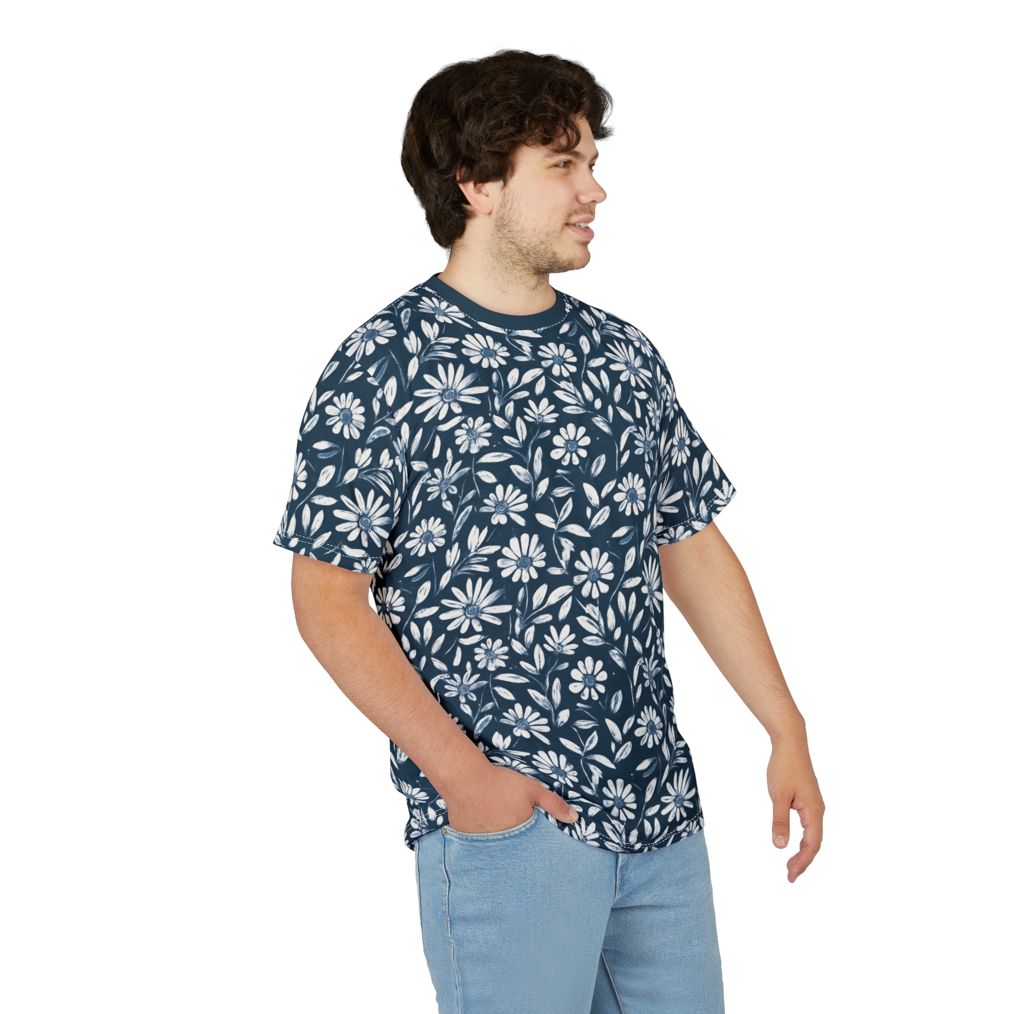 White daisy-like flowers and stylized leaves cover this dark blue t-shirt.