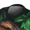 Rich green leaves cover this sublimation graphic tee, framing highly detailed brown animal fur against dark shadows.
