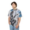 All over print sublimation tee, graphic design featuring a shadowy figure playing electric guitar, collage of newspaper text, blue paint splatters.
