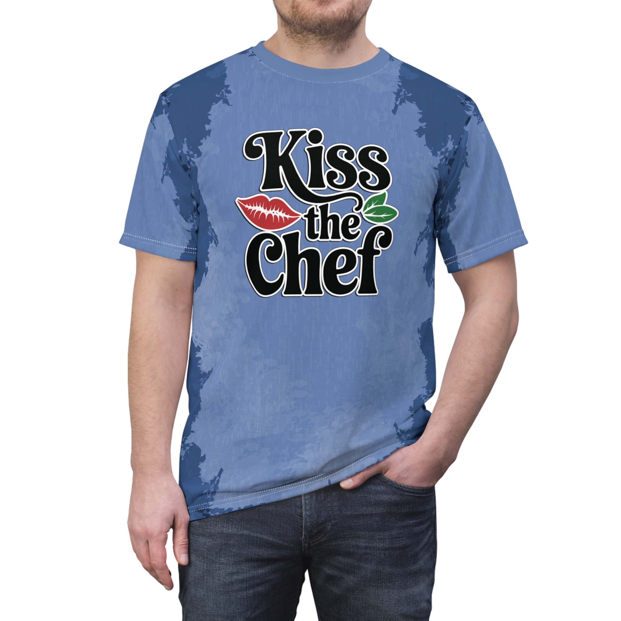 Blue and lighter blue abstract brushstroke patterns cover this patterned tee shirt, featuring the text "Kiss the Chef" with red lips and green leaves.