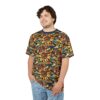 Vibrant yellows, oranges, reds, and blues form a mosaic of sunflowers and leaves across this patterned tee shirt, creating a stained-glass effect.
