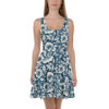 Navy blue skater dress with a vintage pattern of white flowers and leaves, featuring a seamless wrap around graphic design.