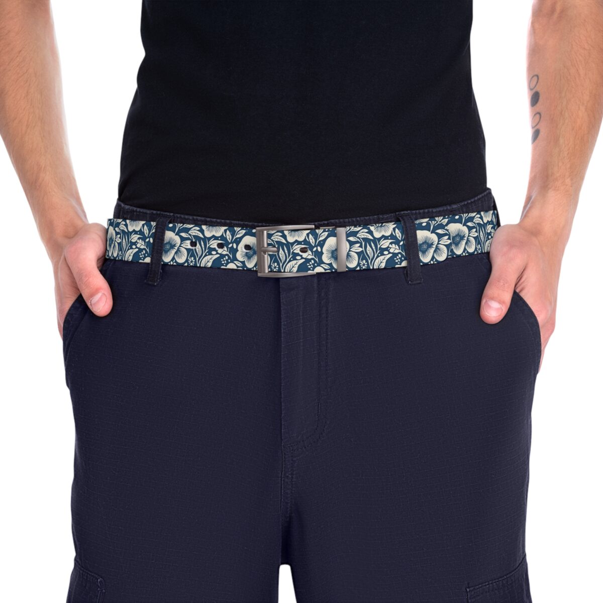 Blue and white floral pattern fabric belt with a silver buckle, accentuating dark navy pants.