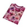Vibrant watercolor poppies and anemones in shades of magenta, fuchsia, and lavender bloom across this pink tee.
