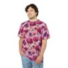 Vibrant pinks and purples of anemone and tulip blooms cover this graphic streetwear tee, set against a soft pink background with delicate green stems.