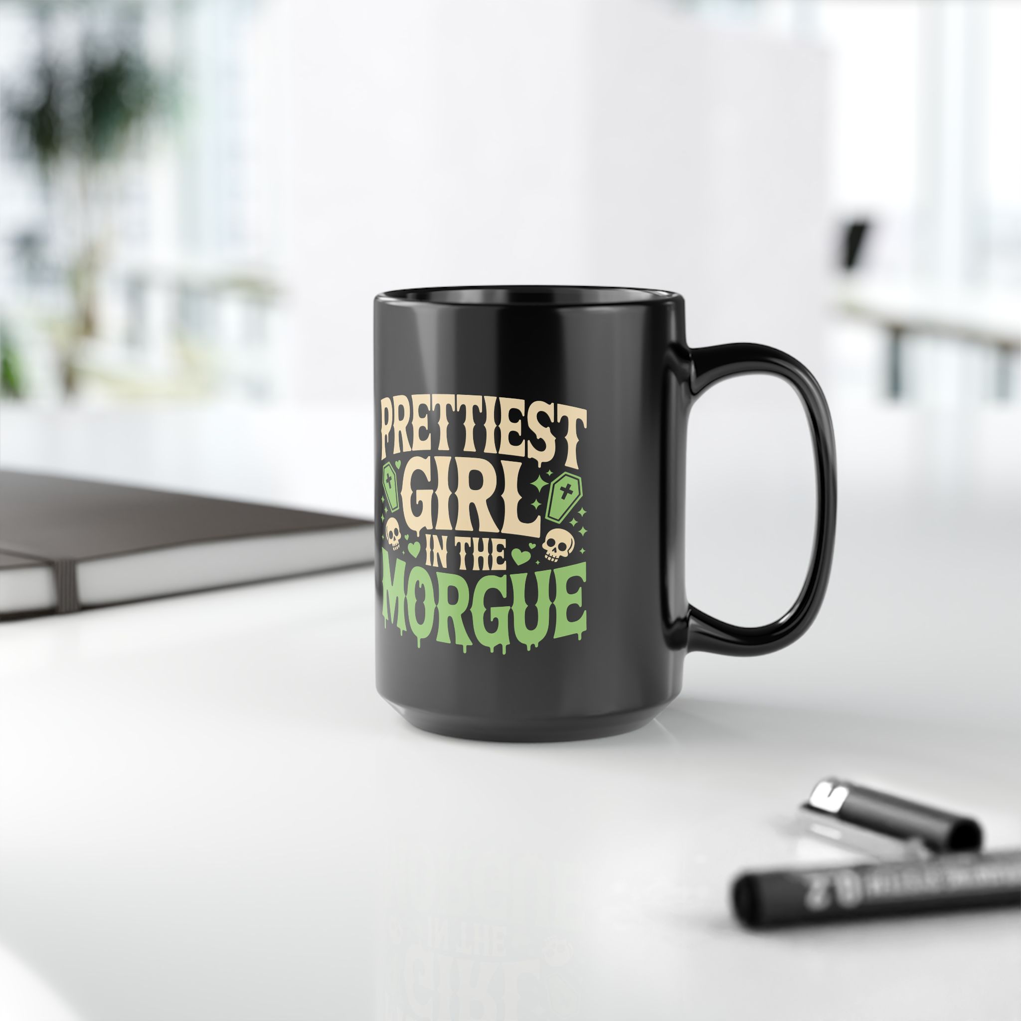 Black ceramic mug with a quirky, gothic-themed graphic in lime green and beige text.