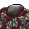 All over print t-shirt featuring a vintage grapevine graphic with purple grapes and green leaves on a maroon background.
