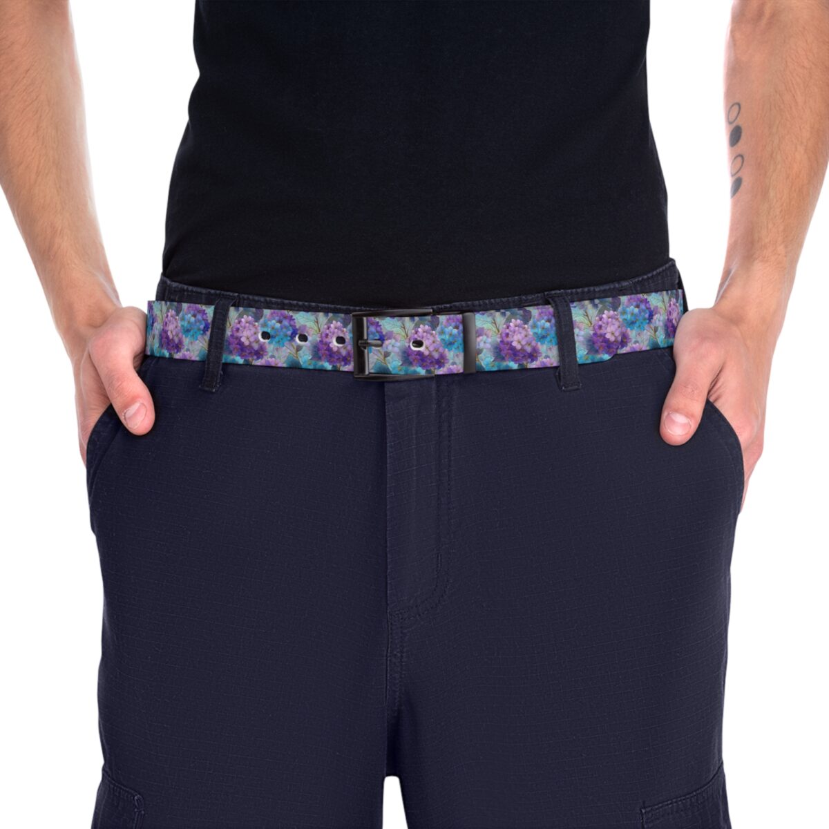 Purple and blue floral print belt featuring a seamless wrap-around design with a black buckle. Perfect for adding color to outfits.