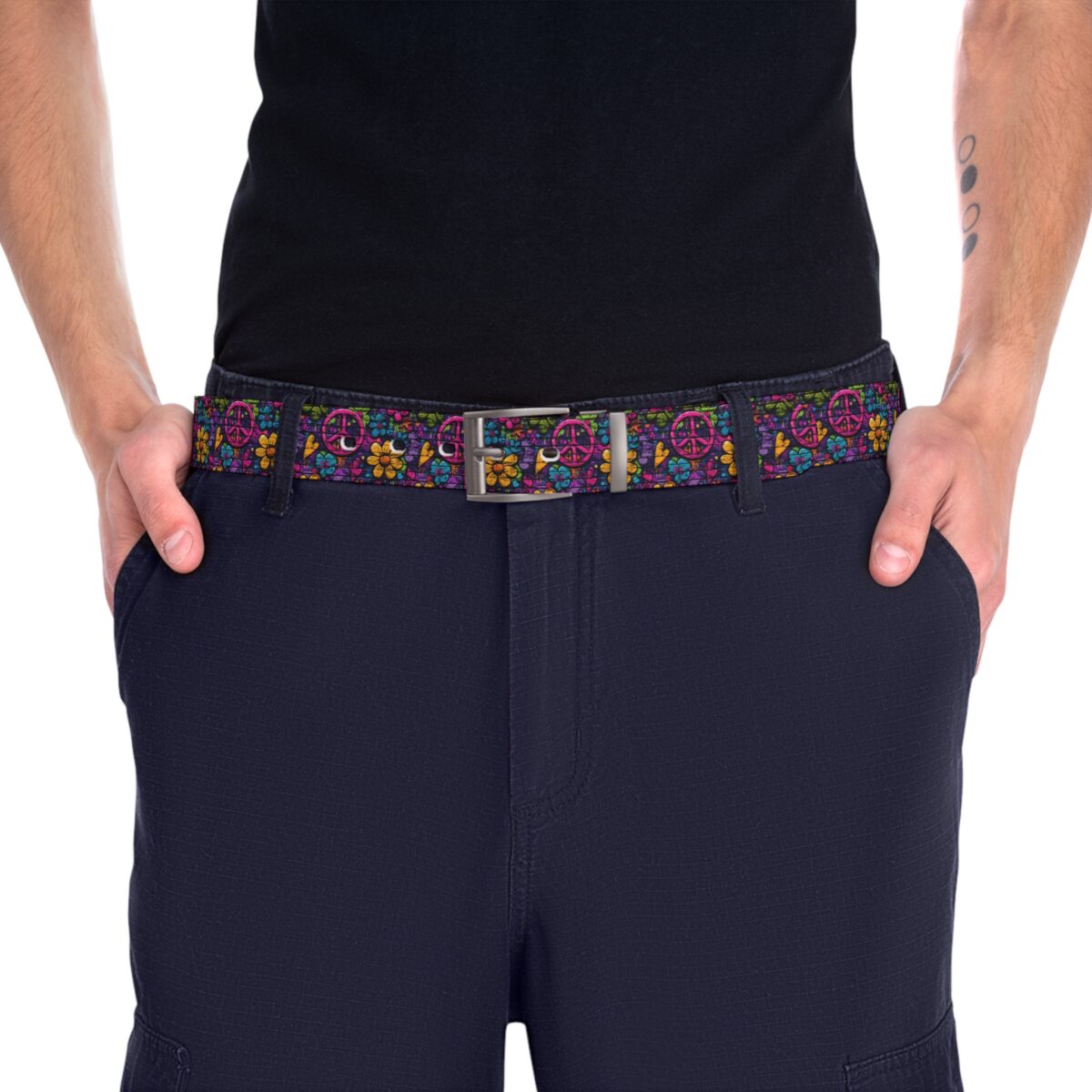 Retro peace sign and flower pattern belt with vibrant colors and a metal buckle.