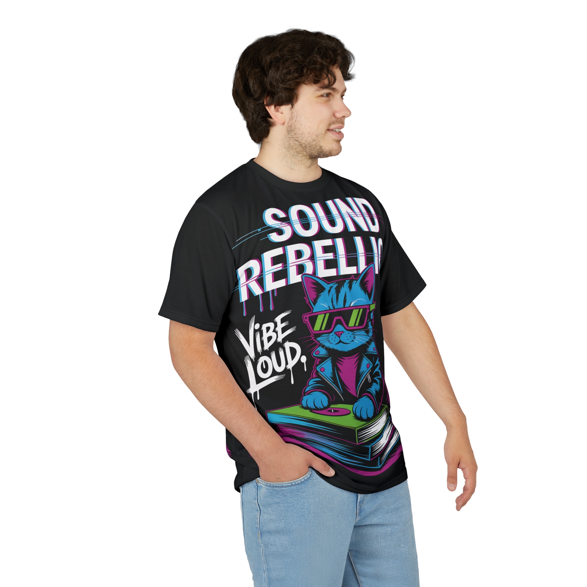Bright pink, blue, and green neon colors cover this sublimation graphic tee, depicting a cool cat DJ with sunglasses on a stack of books.