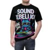 Blue and pink neon drips and glitch text cover this oversized full print tee, depicting a cool cat DJing on vinyl records.