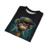 Teal and black abstract shapes cover this graphic streetwear tee, depicting a cool monkey character in a green cap and jacket.