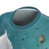 Teal all over print t-shirt with abstract floral and white sail graphics.