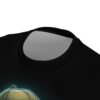 A bold graphic of a monkey wearing a hat covers this streetwear tee, set against a dark, textured background with subtle green glow effects.