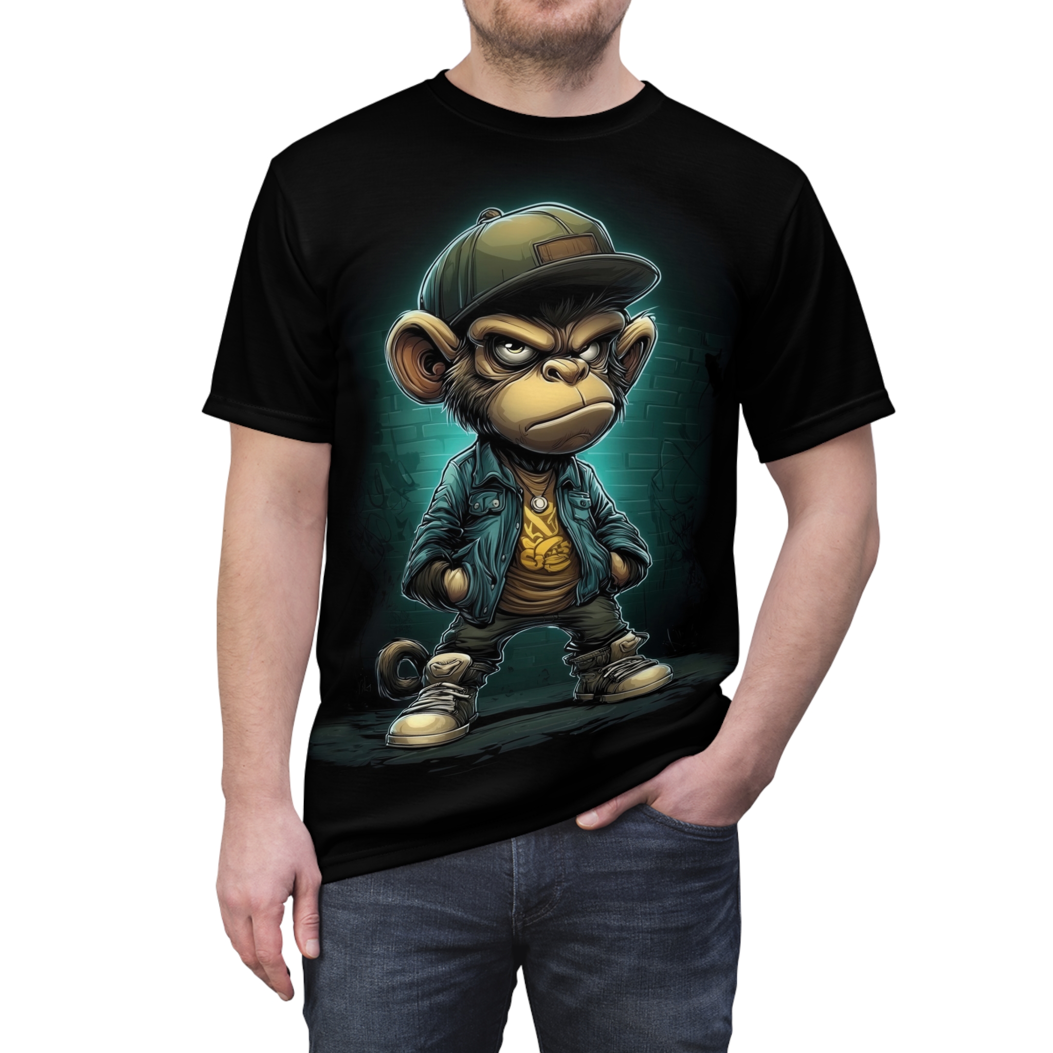 A cartoon monkey in a green cap, blue jacket, and yellow shirt is depicted on this black graphic tee shirt, with a brick wall in the background.