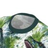 Green and blue watercolor splashes and dinosaur heads cover this 3D graphic t-shirt with a fierce vibe.
