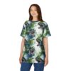 Watercolor green and blue dinosaurs with open mouths and sharp teeth cover this oversized full print tee with a splashy, dynamic vibe.