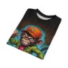 Brown textures and blue energy surround this graphic apparel, depicting an angry cartoon monkey in a green jacket and orange cap.