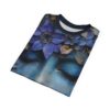 Deep blues, purples, and earthy tones cover this sublimation graphic tee with an artistic portrait and floral details.