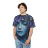 Deep blues and vibrant purples in floral and portrait art cover this seamless pattern tee with an artistic vibe.