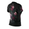 Deep red, pink, and cream climbing roses cover this all over print apparel, winding across a dark textured background.