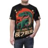 A fierce green Tyrannosaurus Rex with sharp teeth and yellow eyes is printed on this black tee, with a red sun, palm trees, and cherry blossoms.