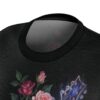 Dark textures cover this graphic streetwear tee, depicting pink roses beside a glowing electric guitar headstock.