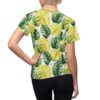 All over print sublimation tee featuring a vibrant green and yellow monstera leaf pattern. Tropical wrap around graphic on this seamless print shirt.