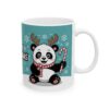 Cute cartoon panda wearing antlers and a scarf holding a candy cane on a teal background with snowflakes.