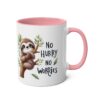 White ceramic mug with a pink handle and interior. Features a cute sloth hanging on a branch with