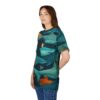 Teal, blue, and orange tones with detailed sharks and a curious figure surround this oversized full print tee, depicting an underwater dreamscape.