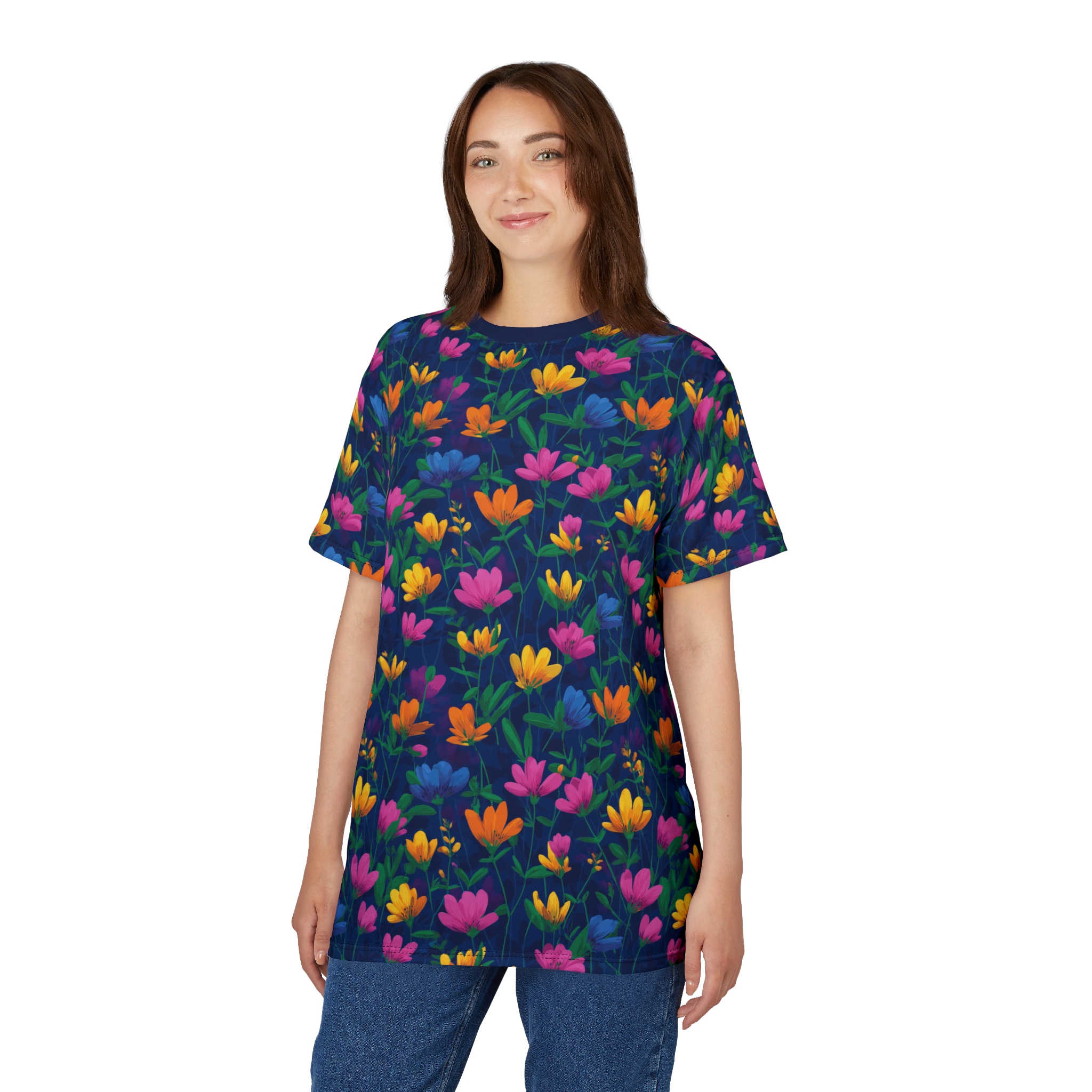 Bright pink, yellow, orange, and blue flowers with green stems cover this graphic streetwear tee, set against a dark navy background.