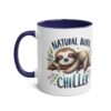 A white ceramic mug with a navy blue handle and interior, featuring a cute sloth illustration and the words 