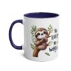 White ceramic mug with a dark blue handle and rim, featuring a cute sloth on a branch with the words