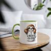 White coffee mug with green accent, featuring a cute sloth saying 