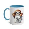 White coffee mug with blue handle and rim, featuring a cute sloth peeking out of a coffee cup with 