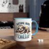 White ceramic mug with a blue rim and handle, featuring a cartoon sloth sleeping on a branch with the words 
